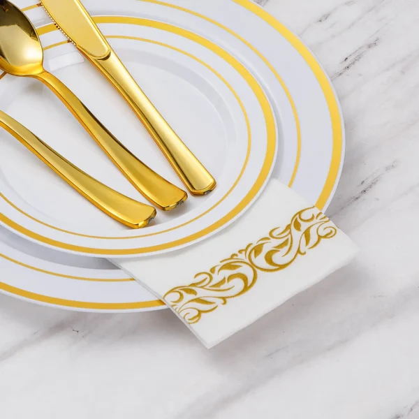 white and gold napkins with silverware
