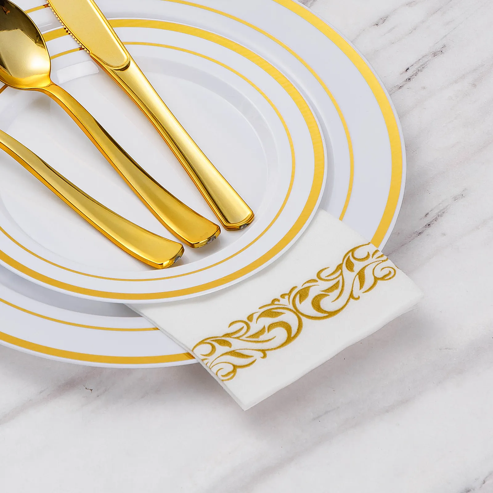 white and gold napkins with silverware
